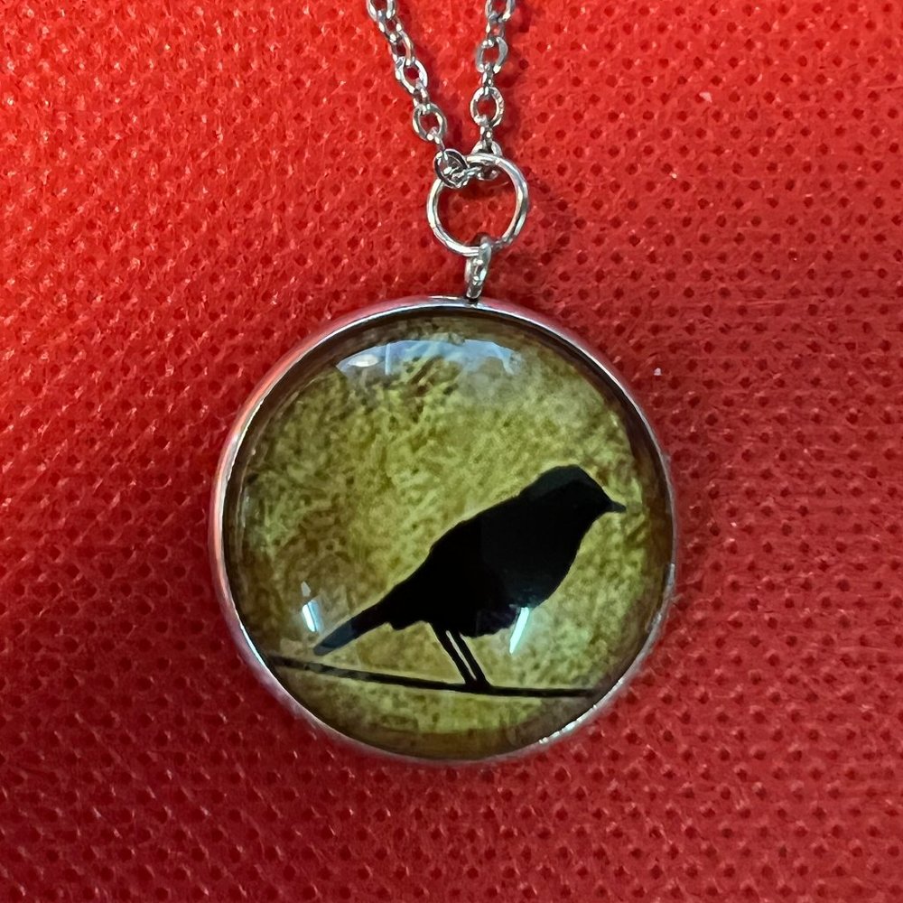 Black Crow Silhouette Standing on Yellow Background Silver Tone Pendant Necklace